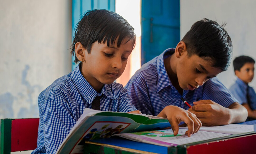 Students studying together with laptops and notebooks