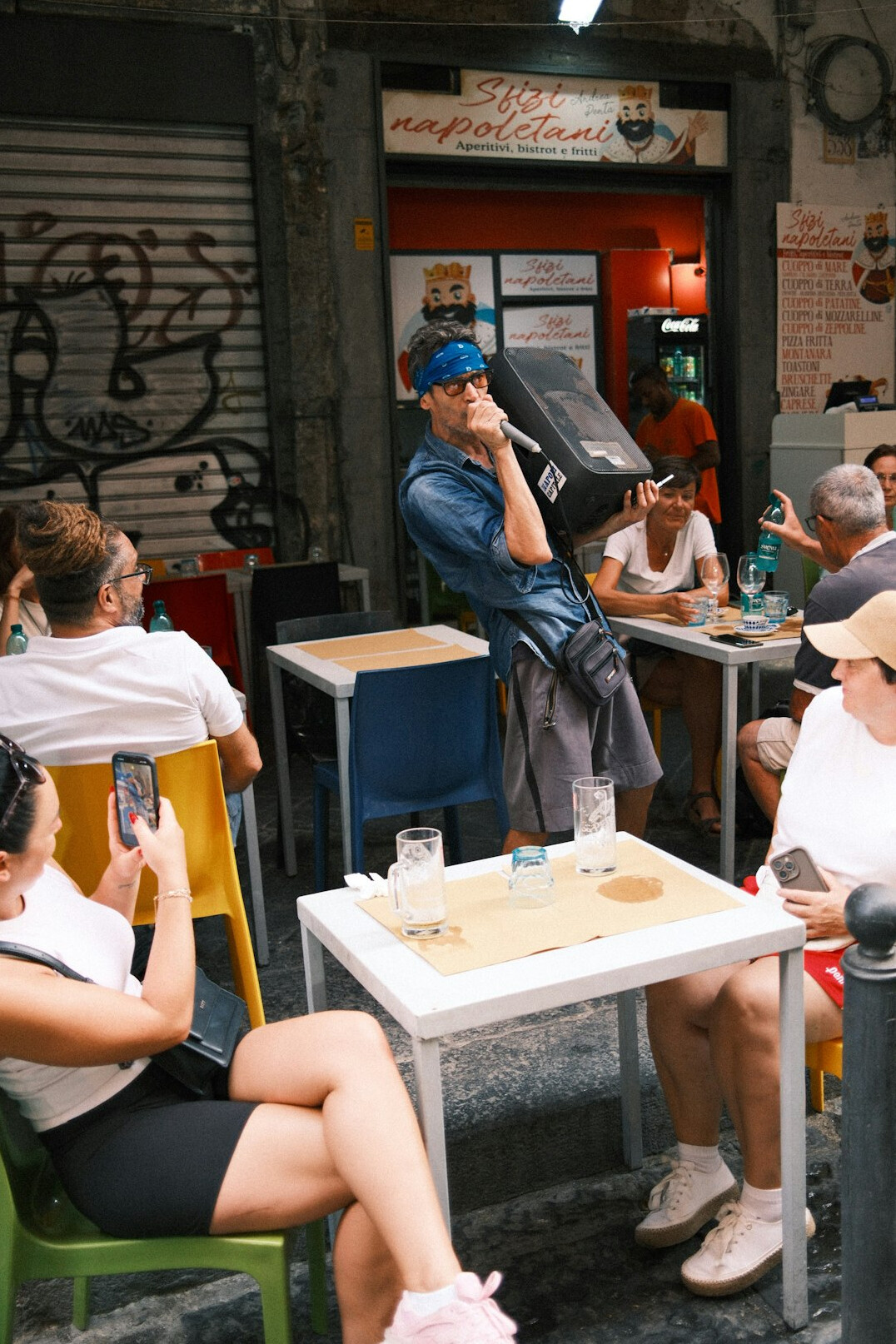 Group of friends talking and listening around a table